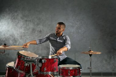 Musician playing drums clipart