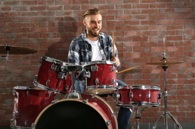 Musician playing drums clipart