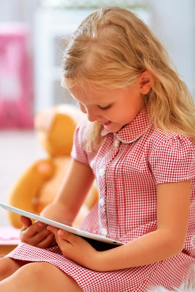 Little girl with tablet — Stock Photo, Image