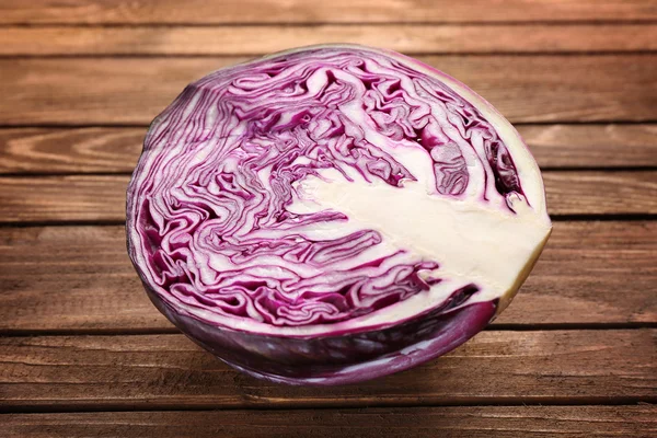 Red cabbage on wooden table — Stock Photo, Image