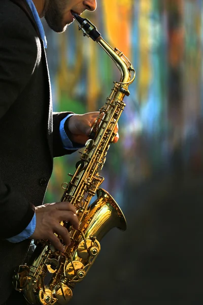 Young man with saxophone — Stock Photo, Image
