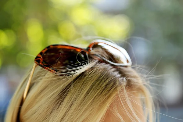 Glasses on head of  girl — Stock Photo, Image