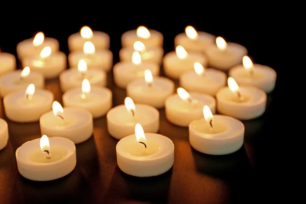 Alight candles in row — Stock Photo, Image