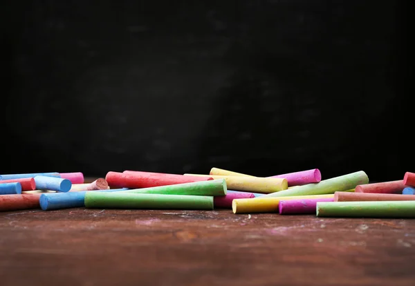 Many chalks on desk — Stock Photo, Image