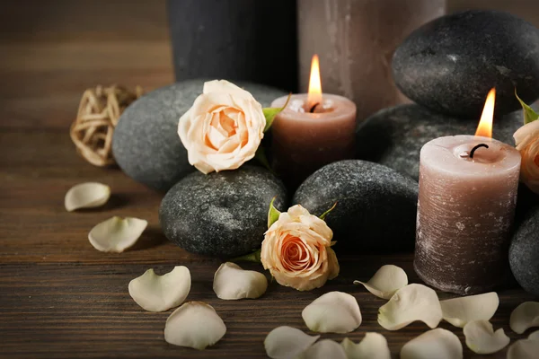 Flowers with lighted candles — Stock Photo, Image