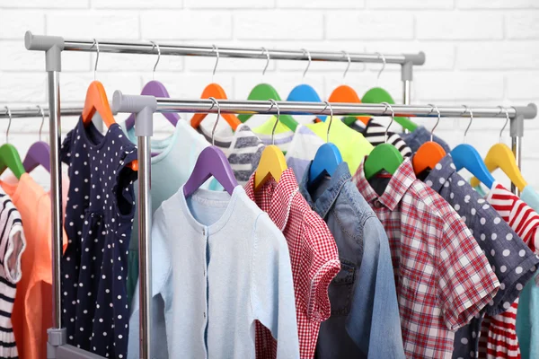Clothes for children on hangers — Stock Photo, Image