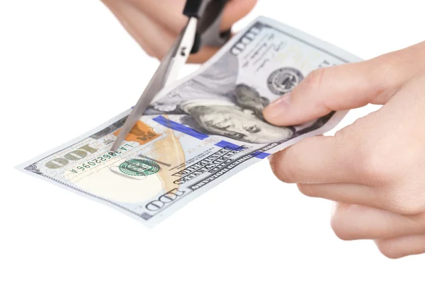 Handen met schaar snijden dollar bankbiljet, geïsoleerd op wit — Stockfoto