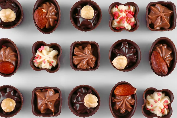 Heerlijke chocolade snoepjes achtergrond, close-up — Stockfoto