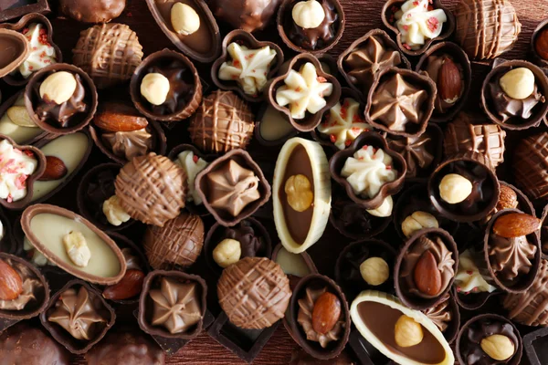 Deliciosos doces de chocolate fundo, close-up — Fotografia de Stock