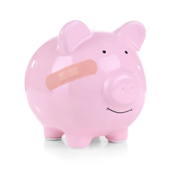 Piggy bank met zelfklevend verband — Stockfoto