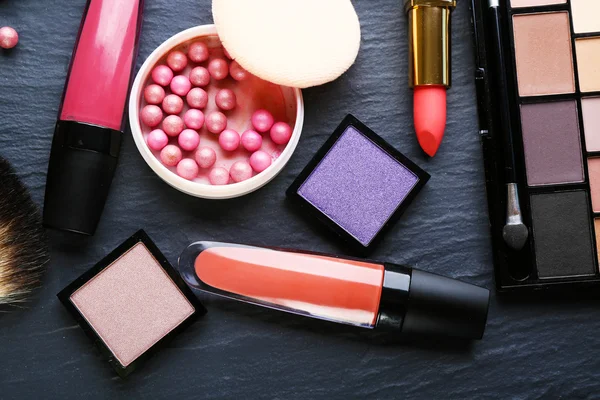 Cosmetics on dark background, closeup — Stock Photo, Image