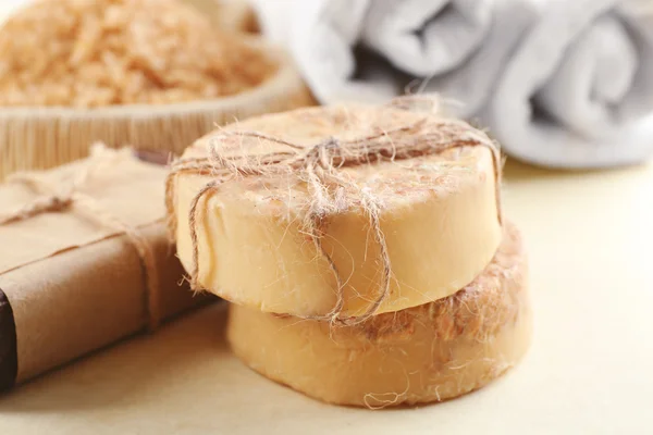 Soap set and salt on a beige background, close up — Stock Photo, Image