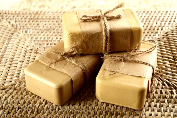 Soap set on a wicker background, close up — Stock Photo, Image