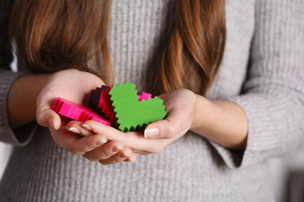 Plastic puzzle hearts — Stock Photo, Image