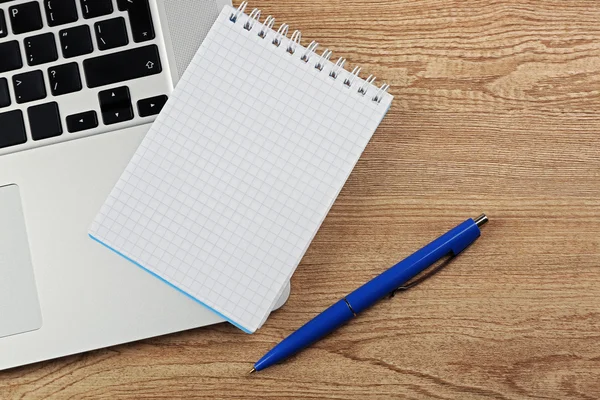 Notebook on laptop keyboard — Stock Photo, Image