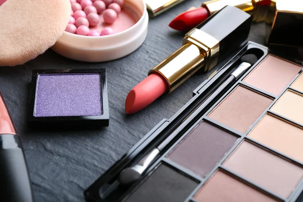 Cosmetics on dark background, closeup — Stock Photo, Image