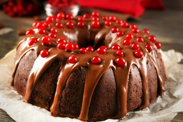 Chocolate cake with snowball tree berries on a table — Stock Photo, Image