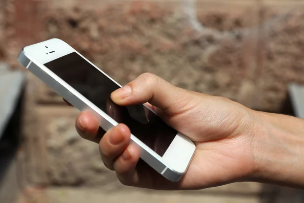 Hand holding smart mobile phone — Stock Photo, Image