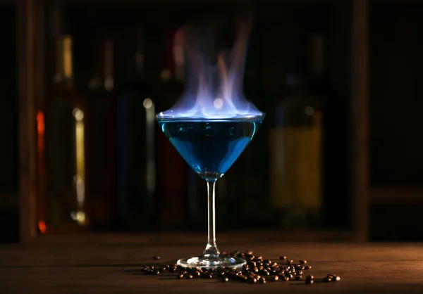 Burning cocktail on table in a bar — Stock Photo, Image