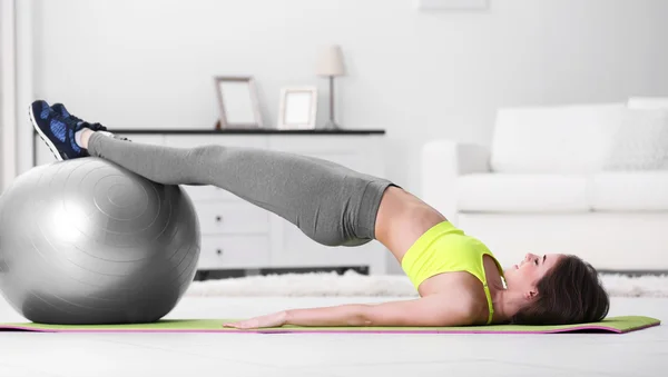 Young girl doing exercises — Stock Photo, Image