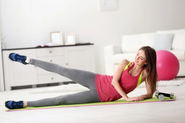 Young girl doing exercises — Stock Photo, Image