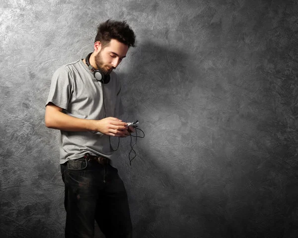 Young bearded man listening music — Stock Photo, Image