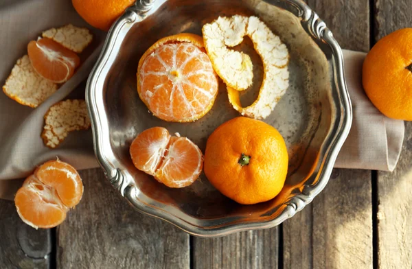 Tangerines on old wooden table, close up — Stock Photo, Image