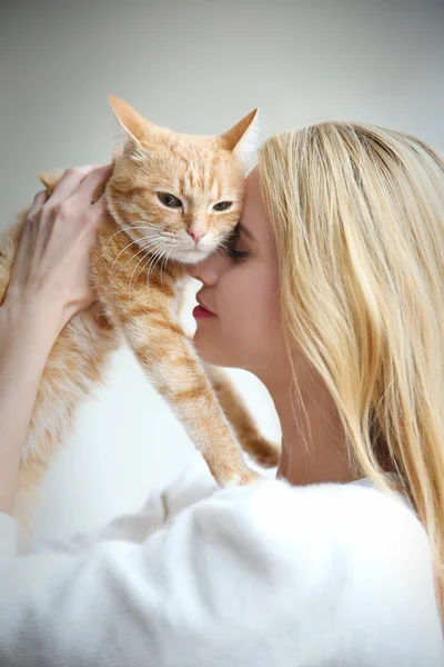 Woman holds red cat in hands Royalty Free Stock Photos