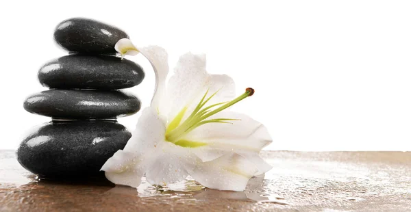 Spa stones with lily, isolated on white — Stock Photo, Image