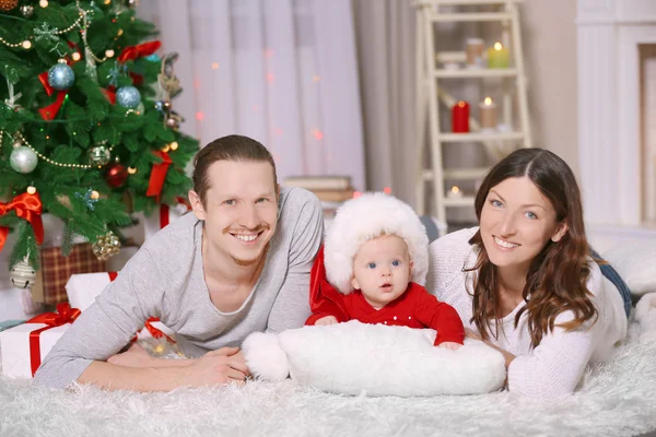 Happy family laying on floor — Stock Photo, Image