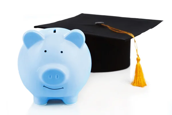 Hucha azul con sombrero de graduación —  Fotos de Stock