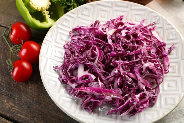 Red cabbage salad served on plate closeup — Stock Photo, Image