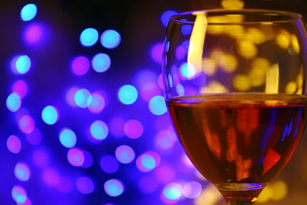 Wine glass with bokeh on dark background — Stock Photo, Image