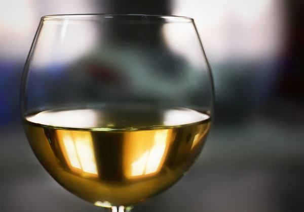 Glass of wine on blurred background — Stock Photo, Image