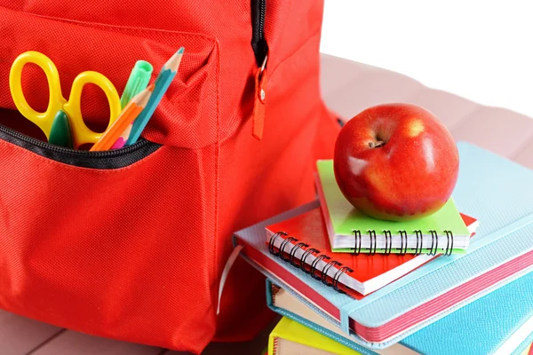 Red backpack full of stationery — Stock Photo, Image