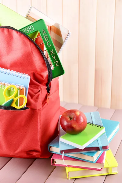 Red backpack full of stationery — Stock Photo, Image