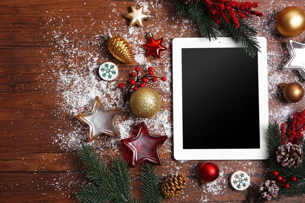 Tablet and Christmas decor — Stock Photo, Image