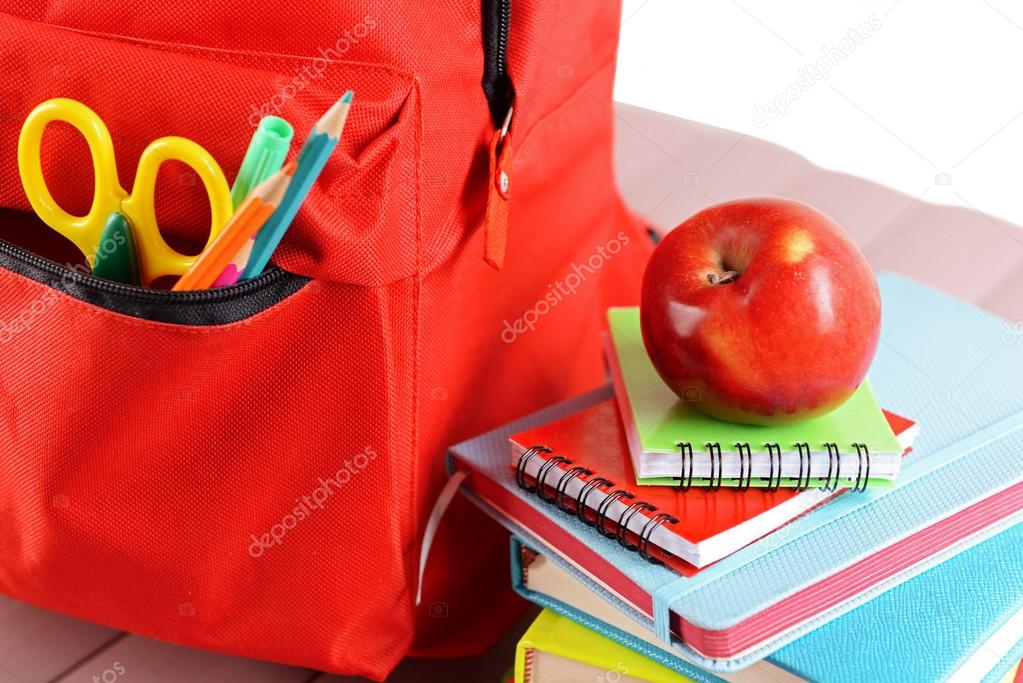 Red backpack full of stationery