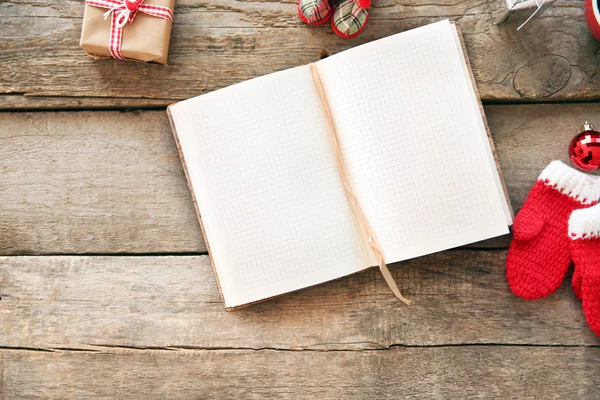 Christmas concept. Opened empty notebook with Christmas decorations on wooden background — ストック写真