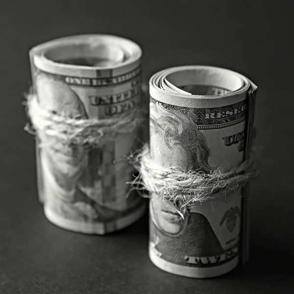 Dollars roll on wooden background — Stock Photo, Image