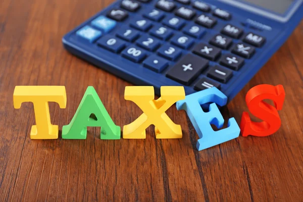 Alfabet belastingen en rekenmachine — Stockfoto
