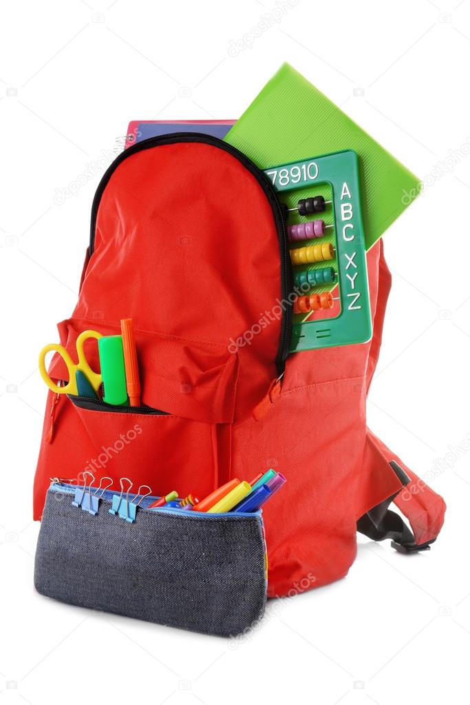 Red backpack with colourful stationary and pencil case isolated on white background