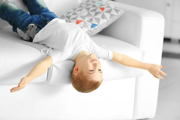 Little boy lying on a sofa — Stock Photo, Image