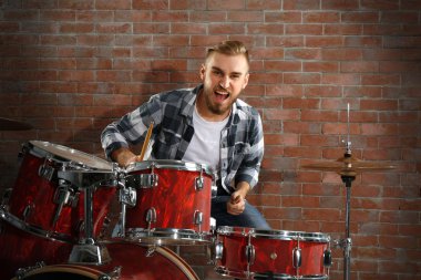 Musician playing drums clipart