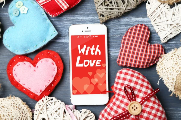 White smart phone with hearts — Stock Photo, Image