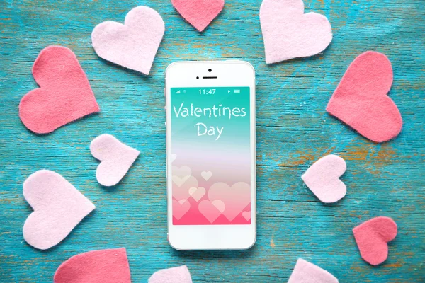 White smart phone with hearts — Stock Photo, Image