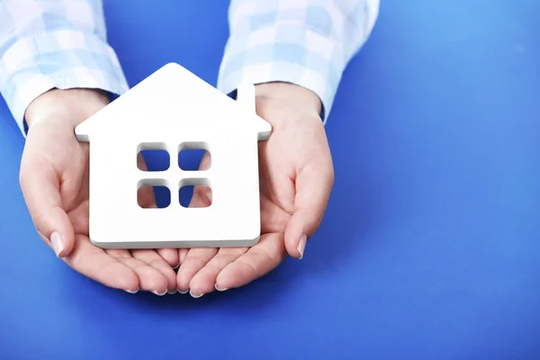 Female hands holding house — Stock Photo, Image