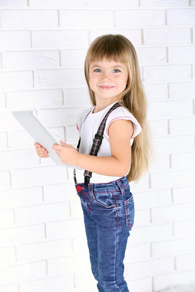 Little girl with tablet — Stock Photo, Image