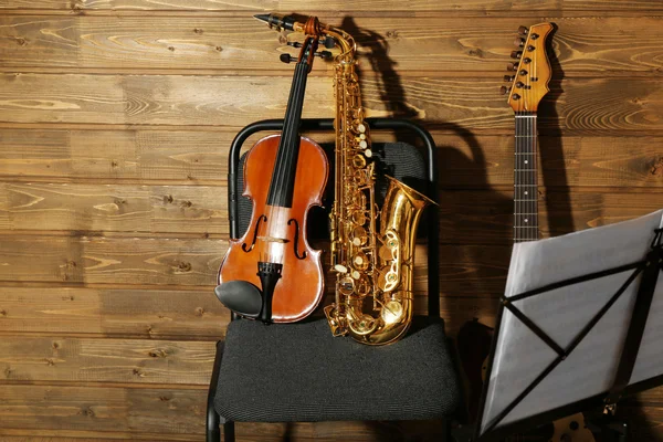 Musical instruments on chair — Stock Photo, Image