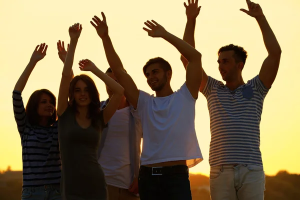 Young people on the riverside — Stock Photo, Image